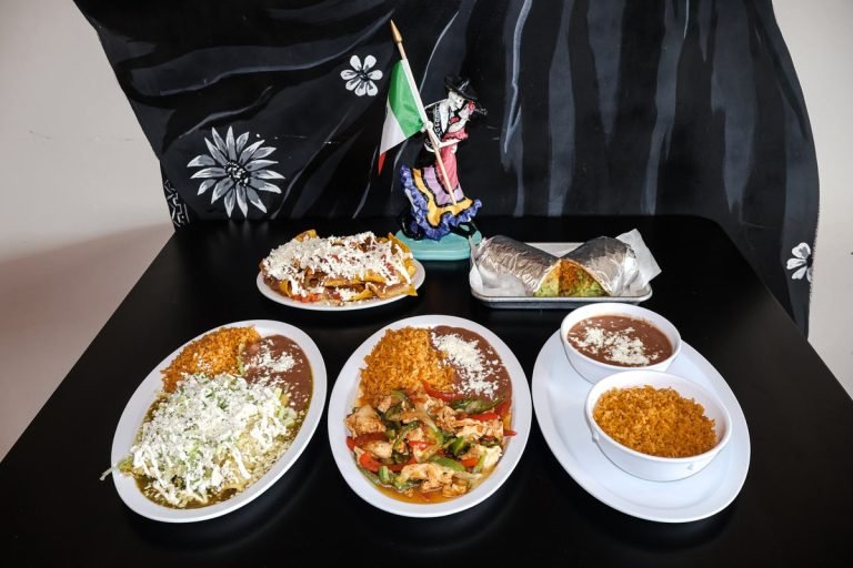 Authentic Mexican food platters with tacos, burritos, rice, and beans at Taqueria Casa Mia Villas NJ