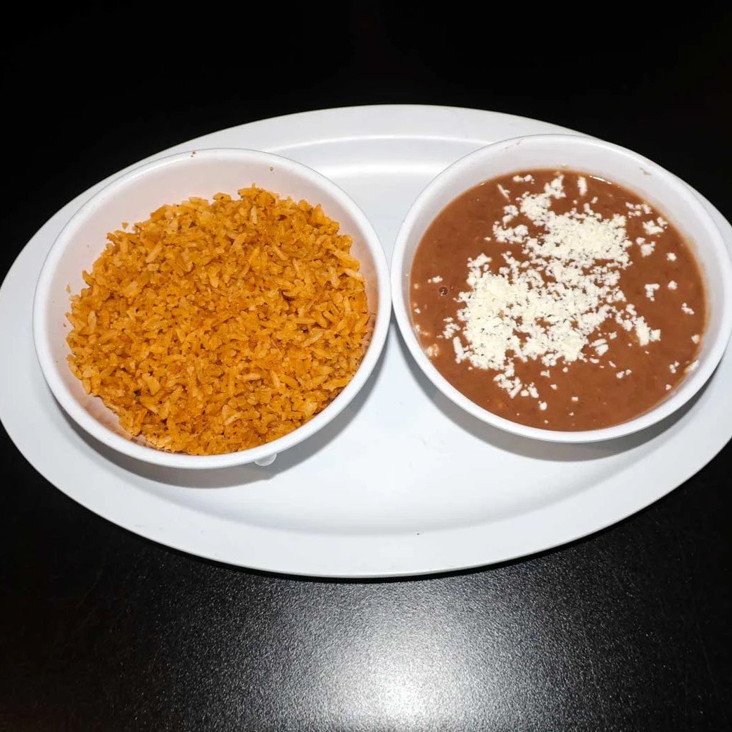 Mexican rice and refried beans with cheese